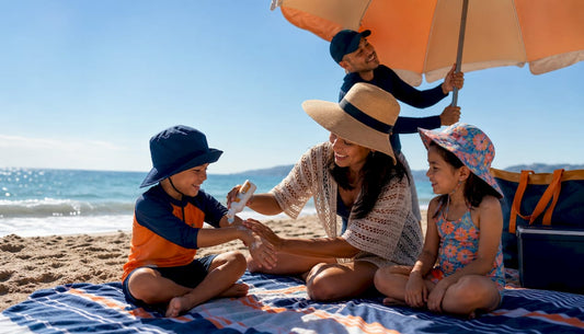 Family applying sunscreen outdoors in park