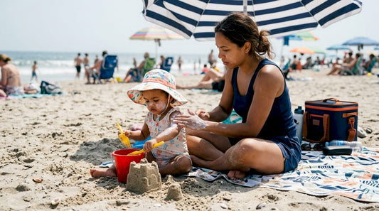 Mother applying sunscreen on toddler outdoors